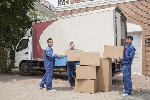 Boxes and furniture being loaded for a Camden moving job