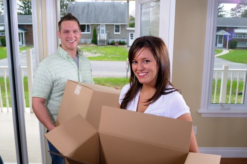 Packed boxes and furniture being prepared for a Camden relocation