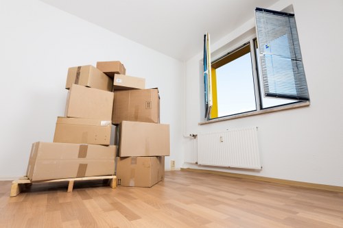 Packed office furniture ready for transport during a Camden relocation