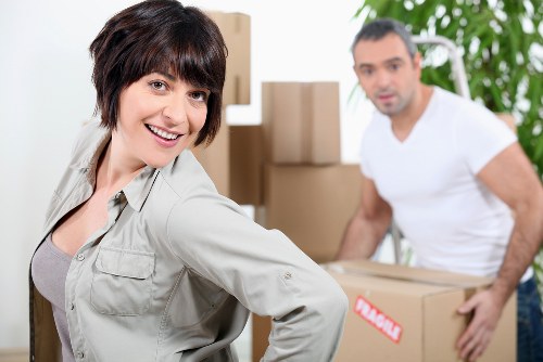 Local movers handling household items in a Camden flat relocation