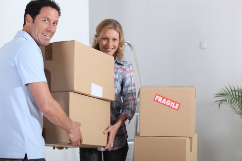 Professional movers navigating stairs and narrow access in Camden