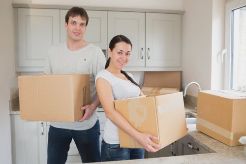 Boxes and furniture arranged in secure storage during Camden removals